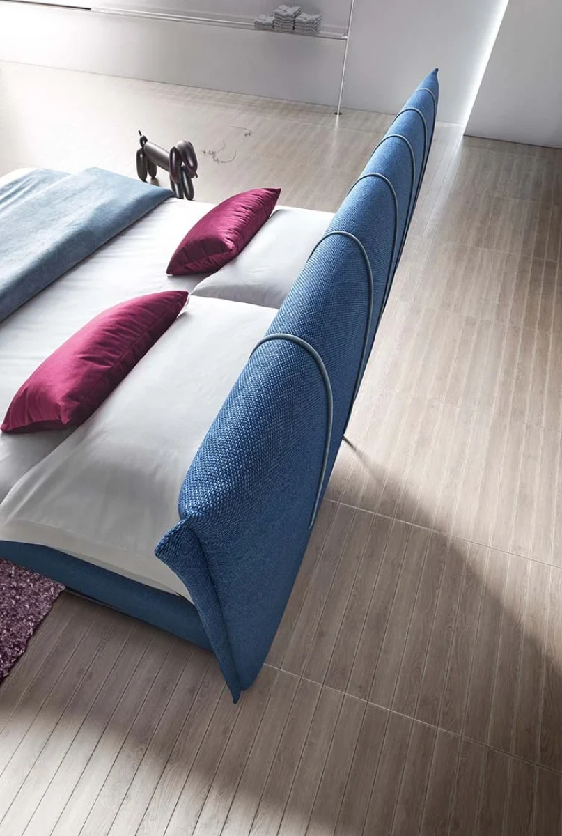 Plumeria — Space-saving bed with a vertically stitched padded headboard.