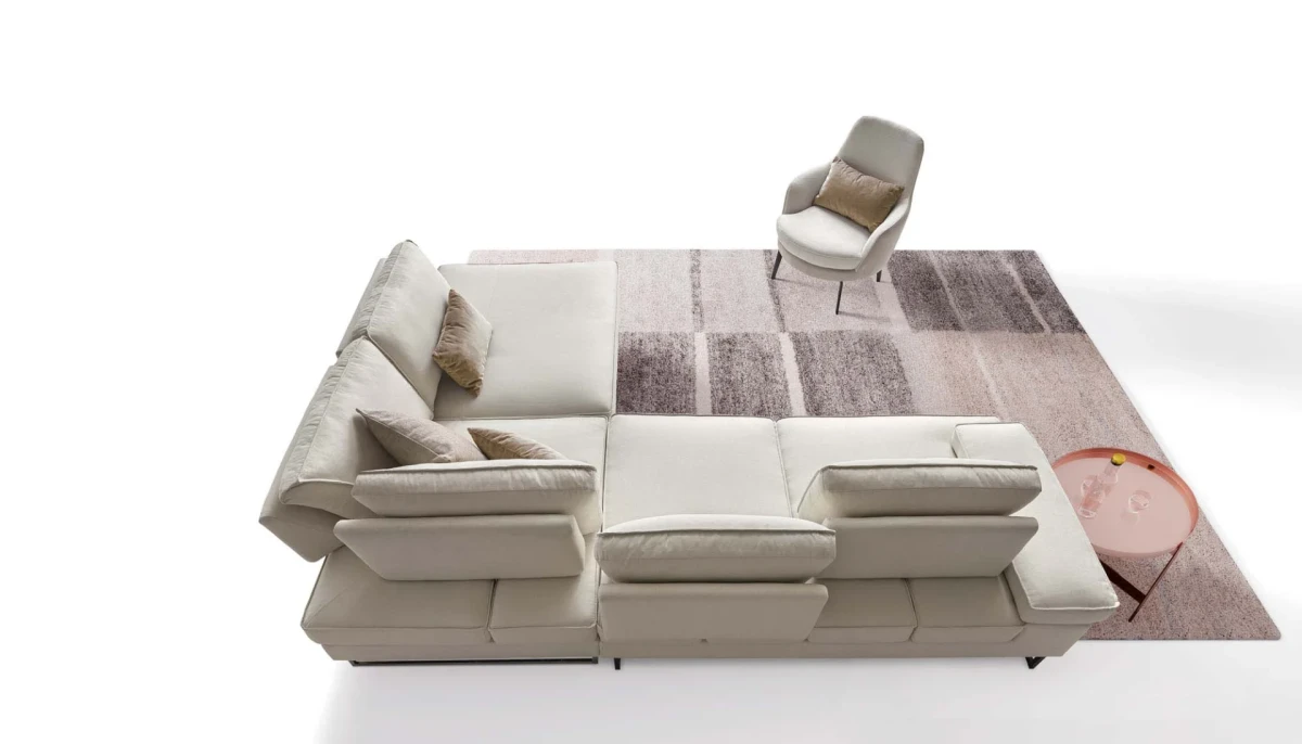 Luis — Sofa with sliding backrest and snap-reclining armrests, finished with elegant borders.