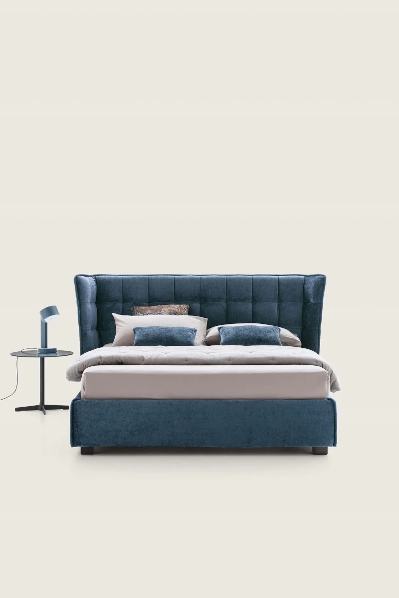 Aspen — Wingback bed with a quilted headboard.