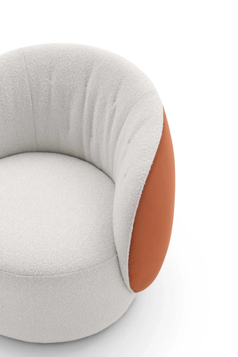 Moby — Rounded one-piece frame armchair with a quilted backrest and optional fixed or swivel base.