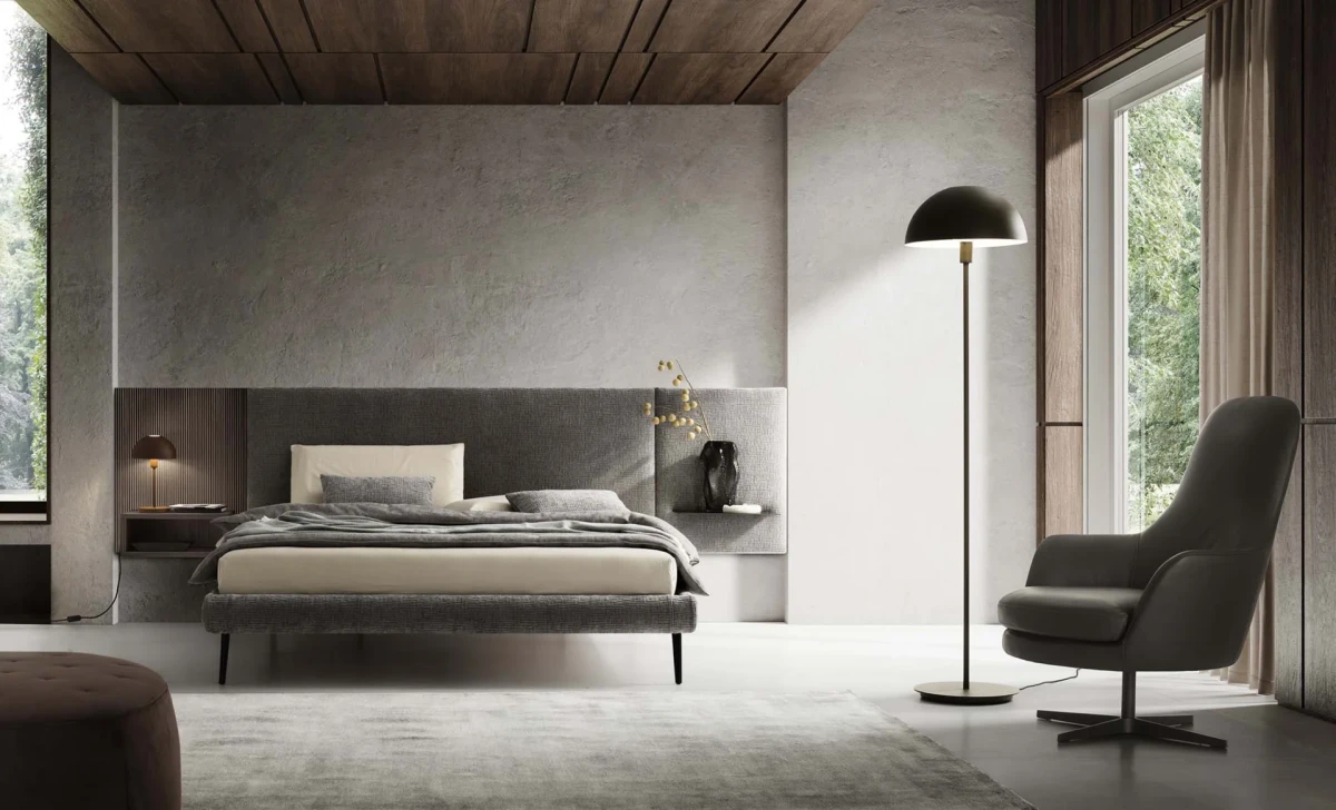 Wall — Contract bed with a simple, smooth padded headboard and side shelves.