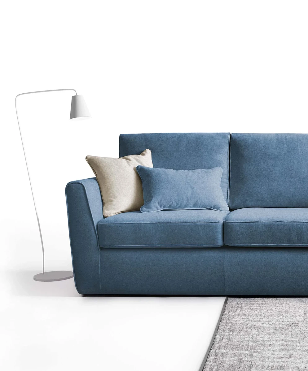Lola — Space-saving sofa with decorative borders and highlighted stitching.