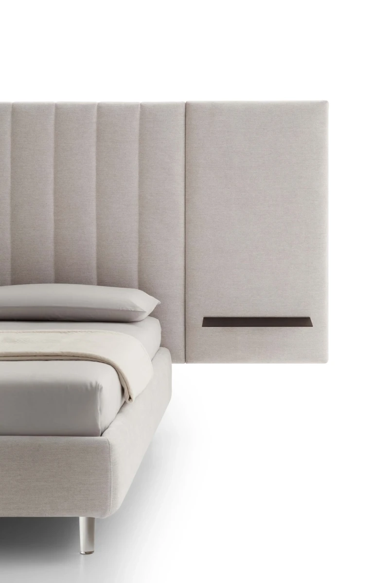 Tile — Contract bed with a vertical padded headboard and side panels with built-in shelves.