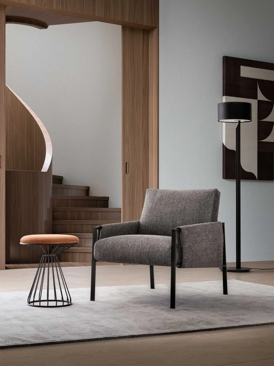 Andy — Armchair with painted metal frame and padded seat, backrest, and armrests. Contemporary industrial design.