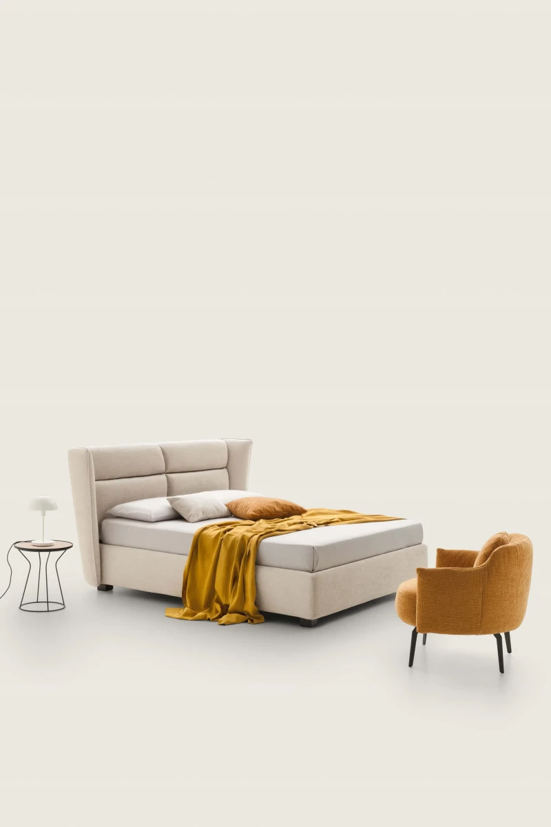 Pasodoble — Elegant wingback bed with wide padded headboard.