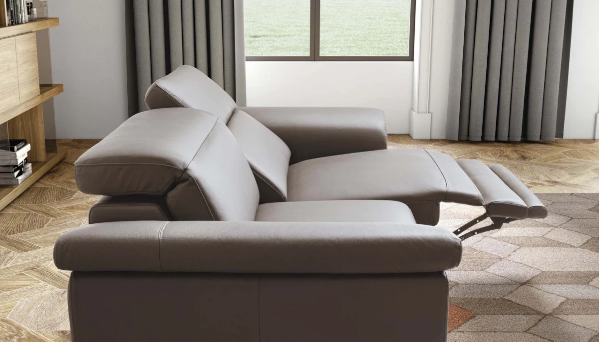 Zeno — Modern recliner sofa with adjustable headrests in a curved, enveloping design.