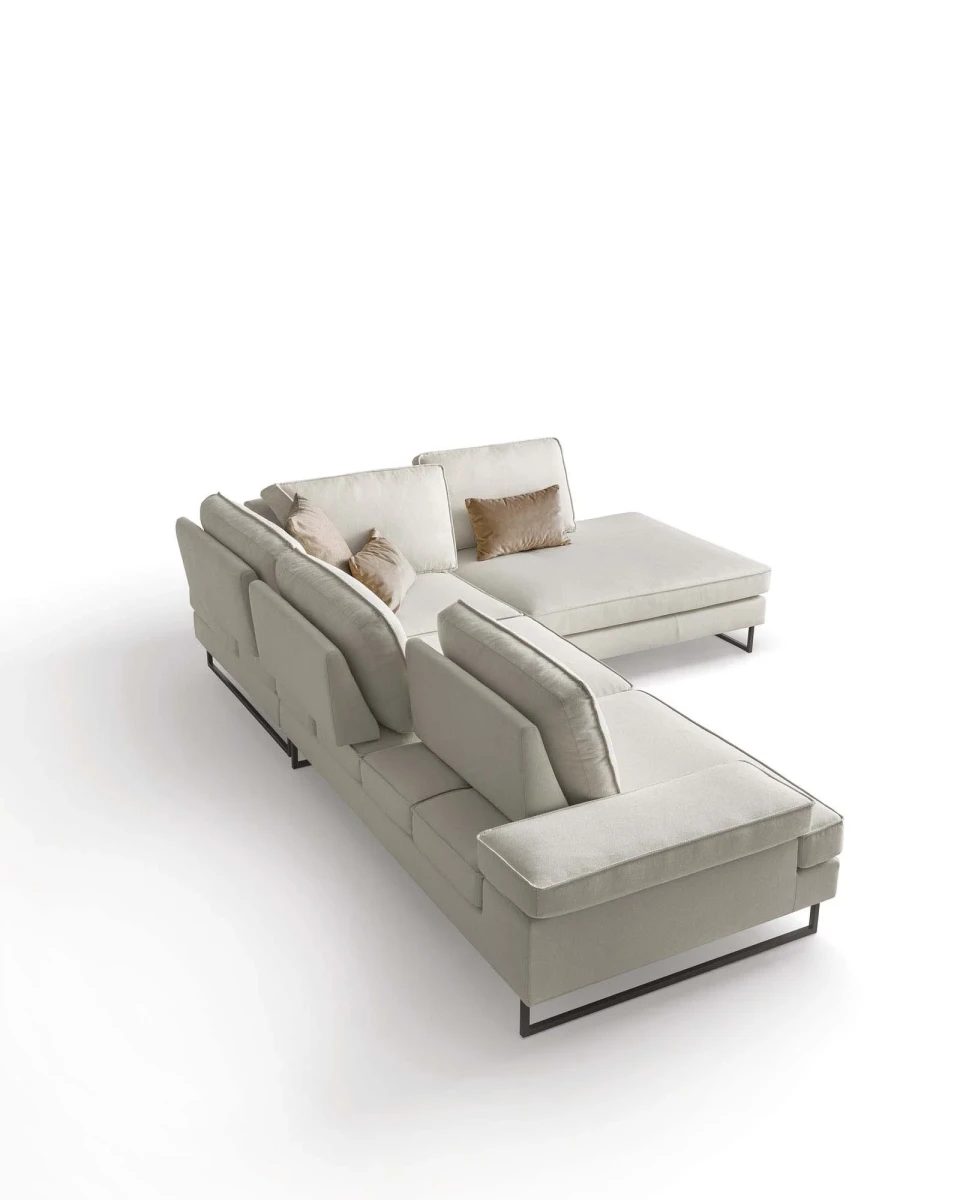 Luis — Sofa with sliding backrest and snap-reclining armrests, finished with elegant borders.
