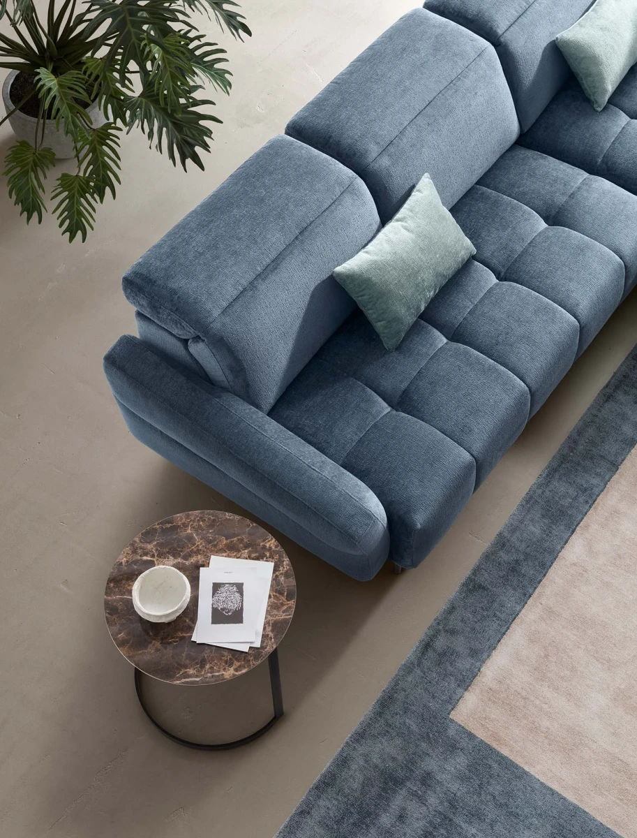 Gillan — Modular sofa with a rounded design, adjustable headrests, and a chaise lounge.