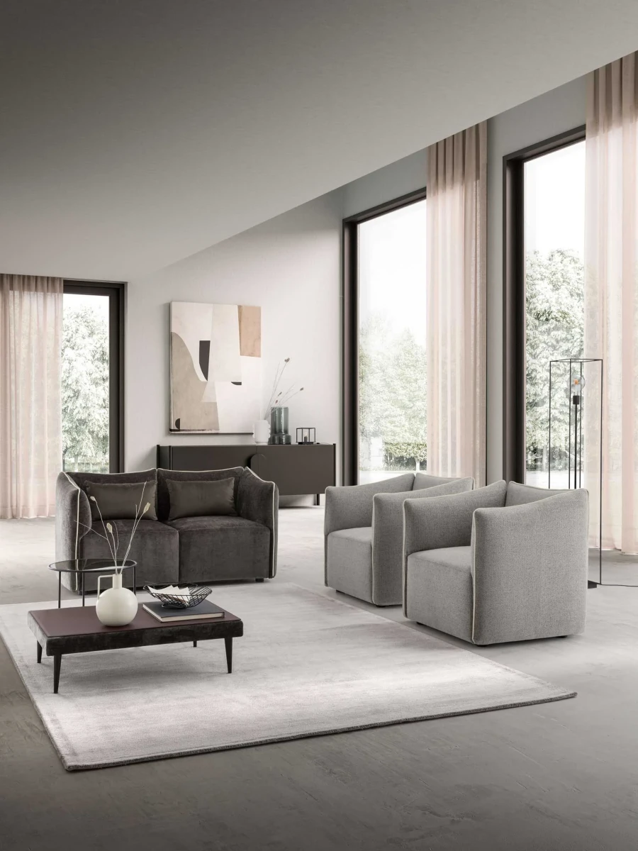 Kubik — One-piece frame armchair with a cubic shape and visible bicolor edges.