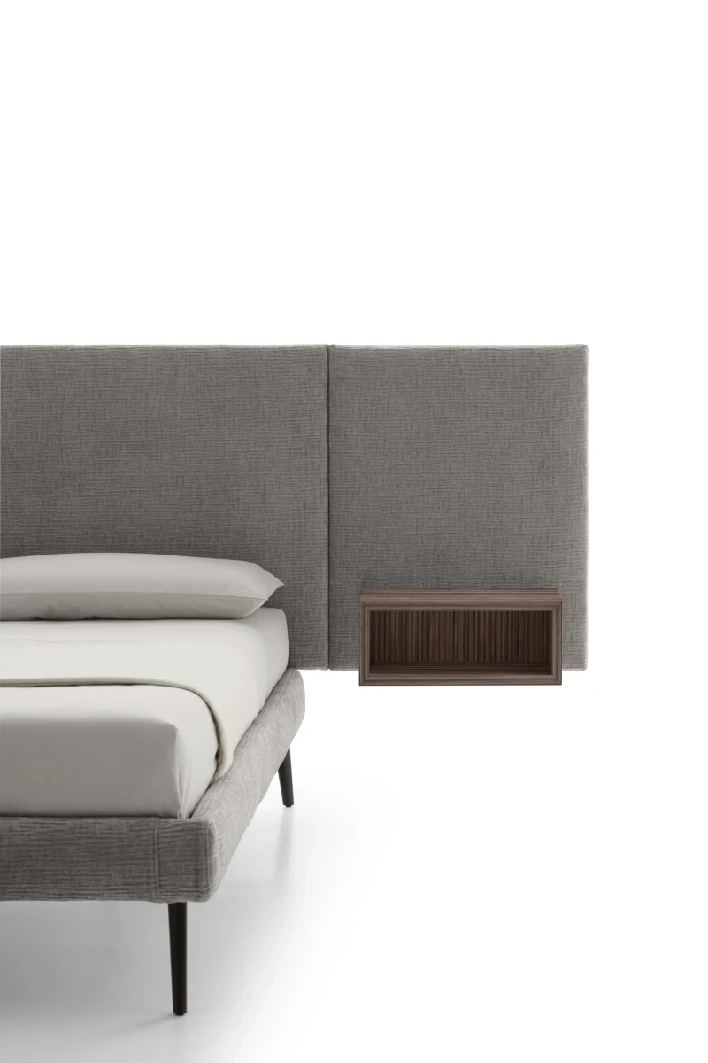 Wall — Contract bed with a simple, smooth padded headboard and side shelves.