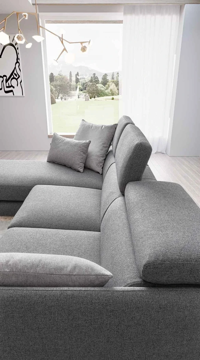 Vanessa — Modern sofa with adjustable headrests and asymmetrical corner seating.