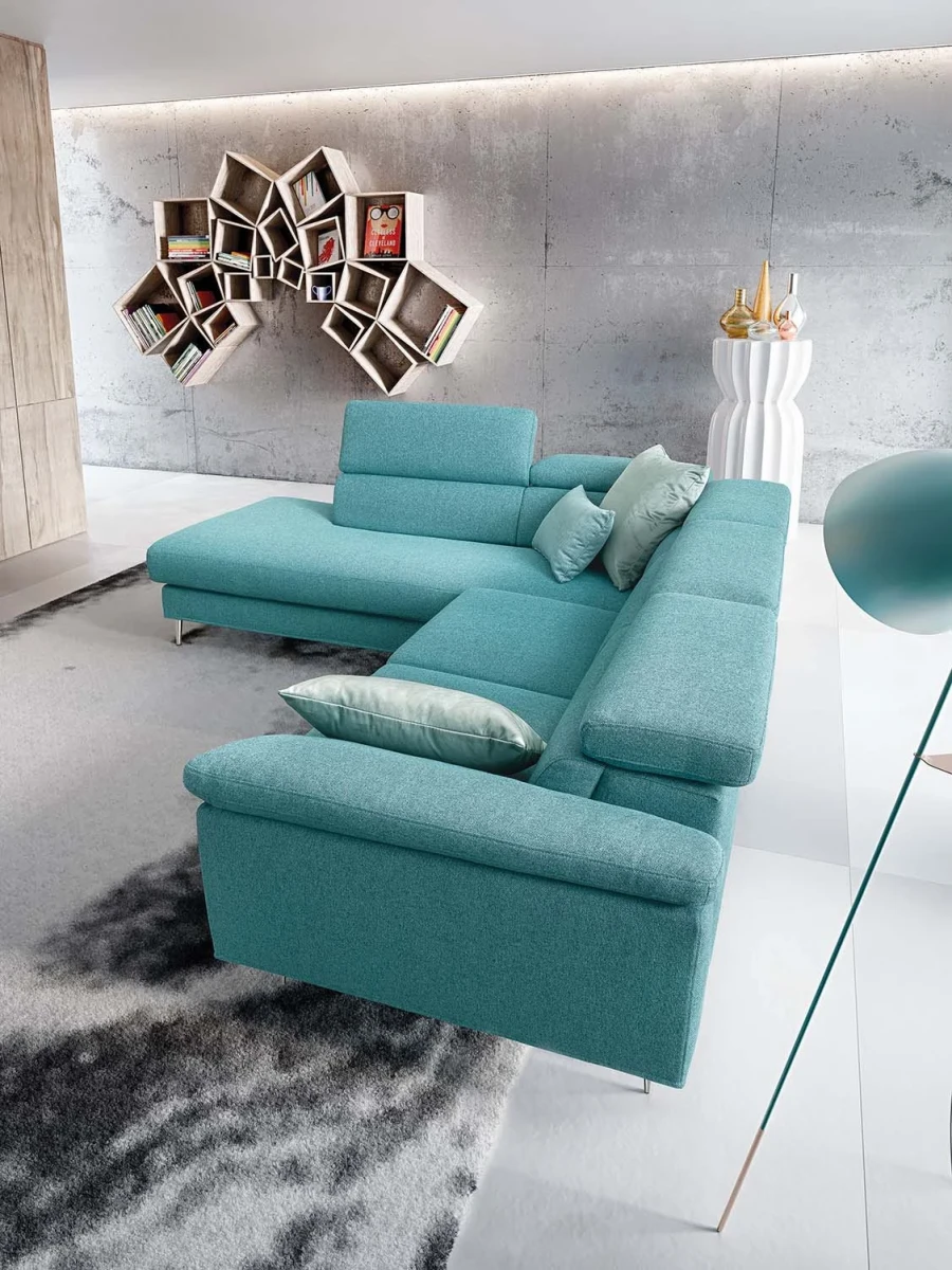 Greta — Modern, minimal sofa with extendable footrest and adjustable headrests.