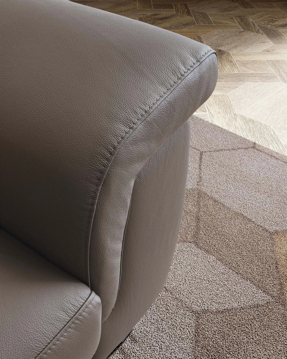 Zeno — Modern recliner sofa with adjustable headrests in a curved, enveloping design.