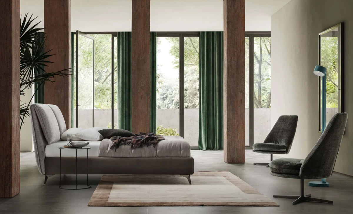 Fold — Bed with a headboard made of large adjustable cushions.