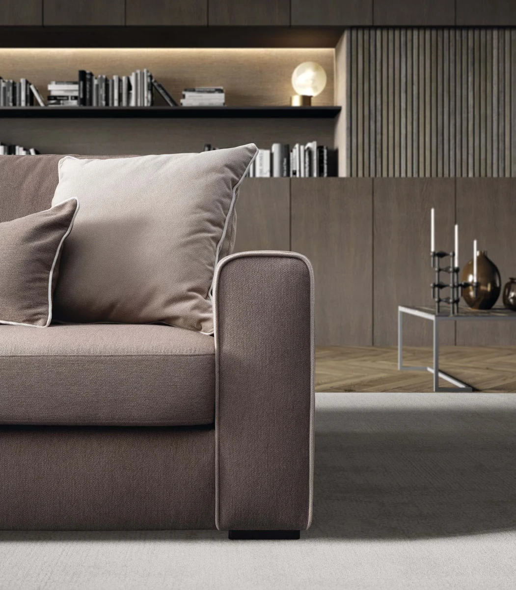 Icaro — Classic sofa with decorative borders and storage mechanism.