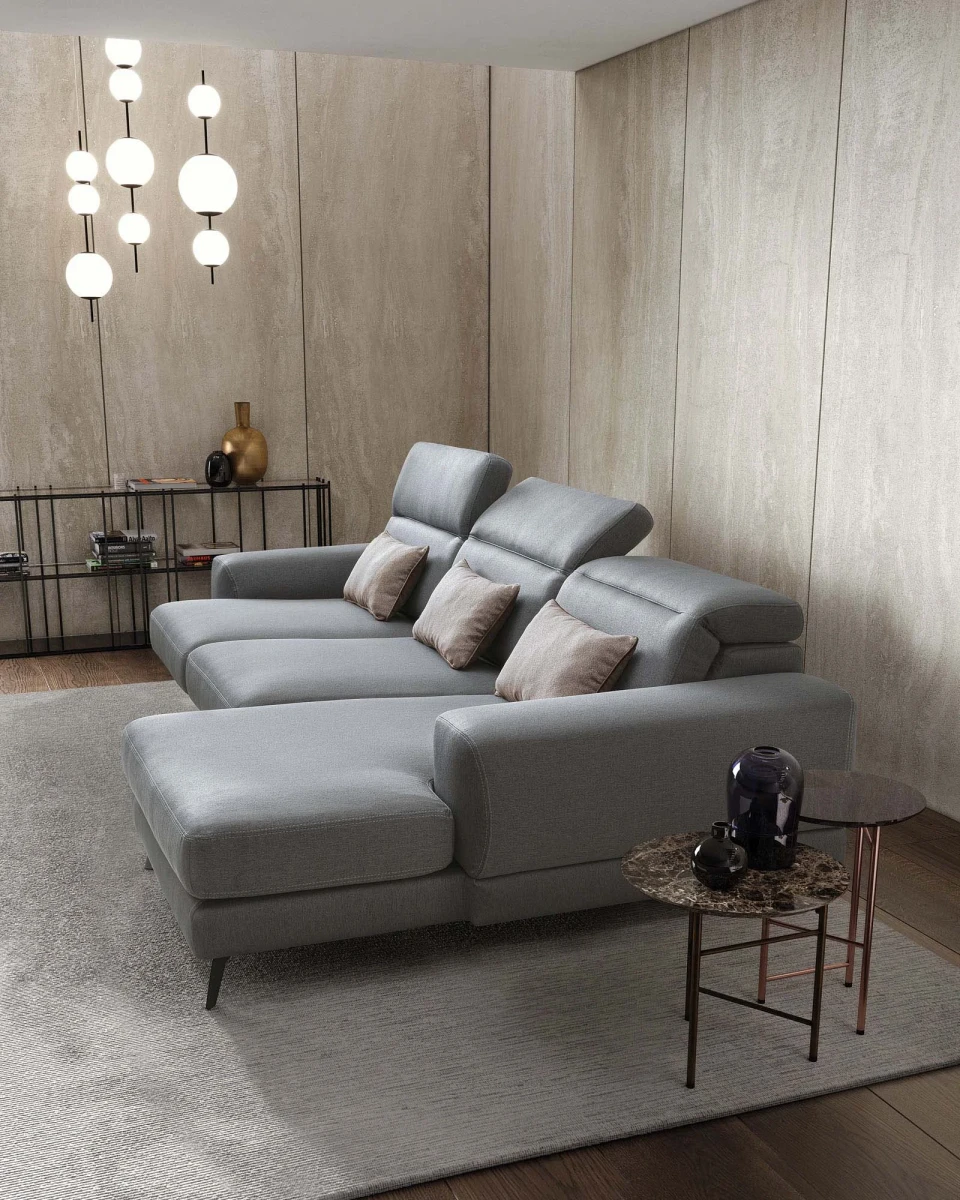 Harvey — Rounded sofa with extendable seats and adjustable headrests.