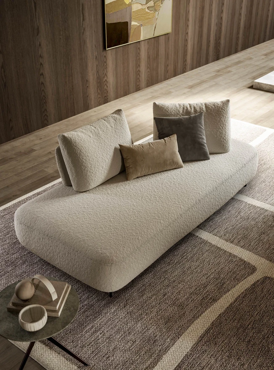 Fanny — Modular sofa with organic shapes, sliding backrests, and adjustable armrests