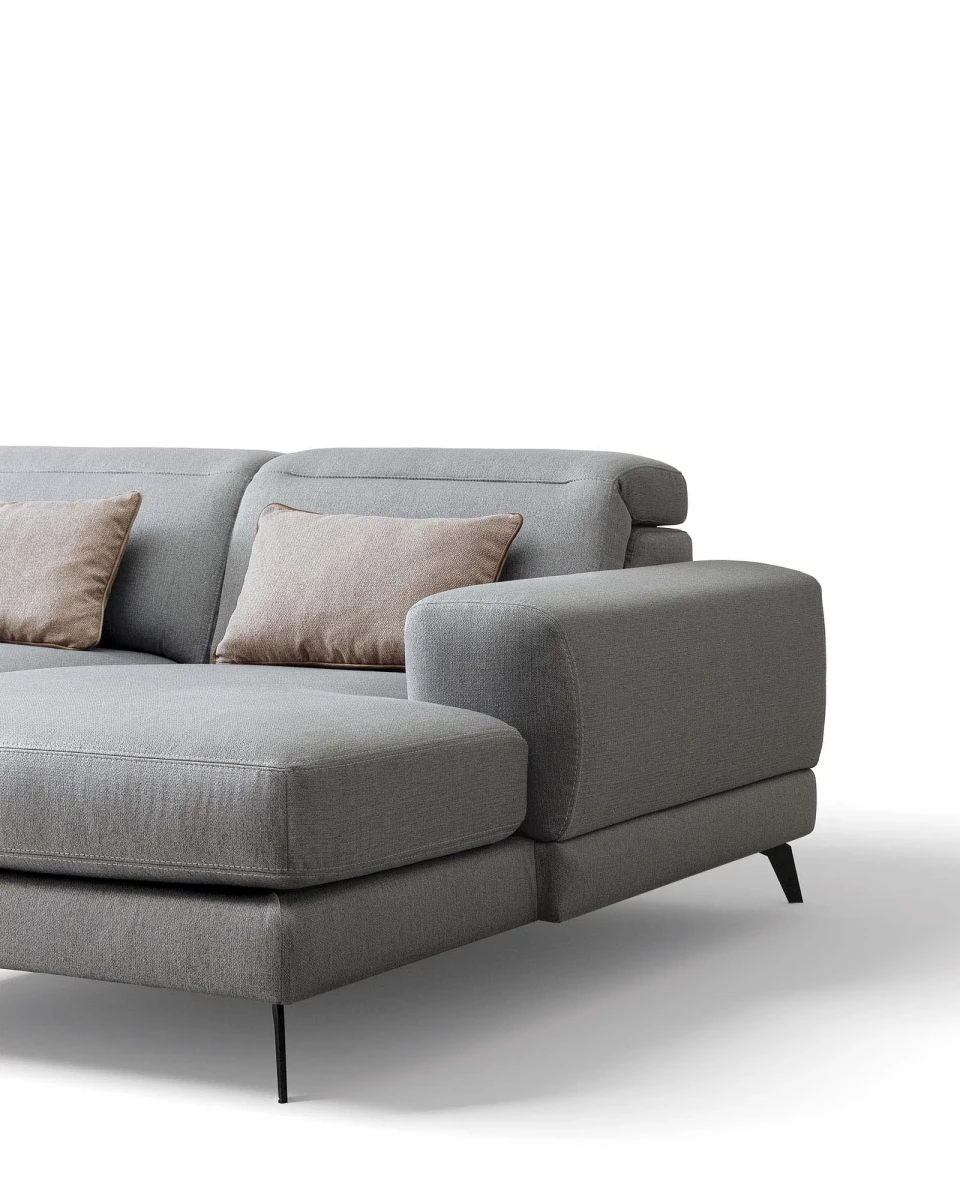 Harvey — Rounded sofa with extendable seats and adjustable headrests.