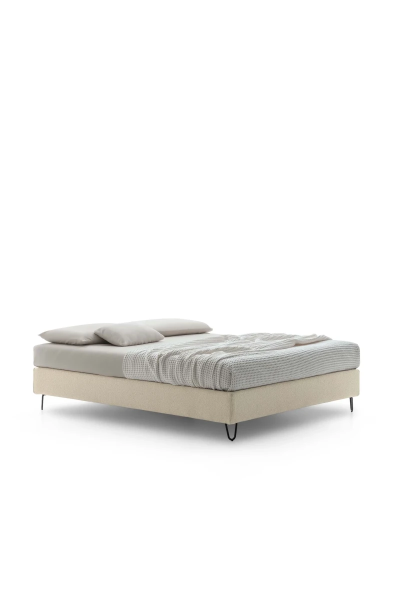 Sommier — Minimalist space-saving bed with no headboard or footboard.