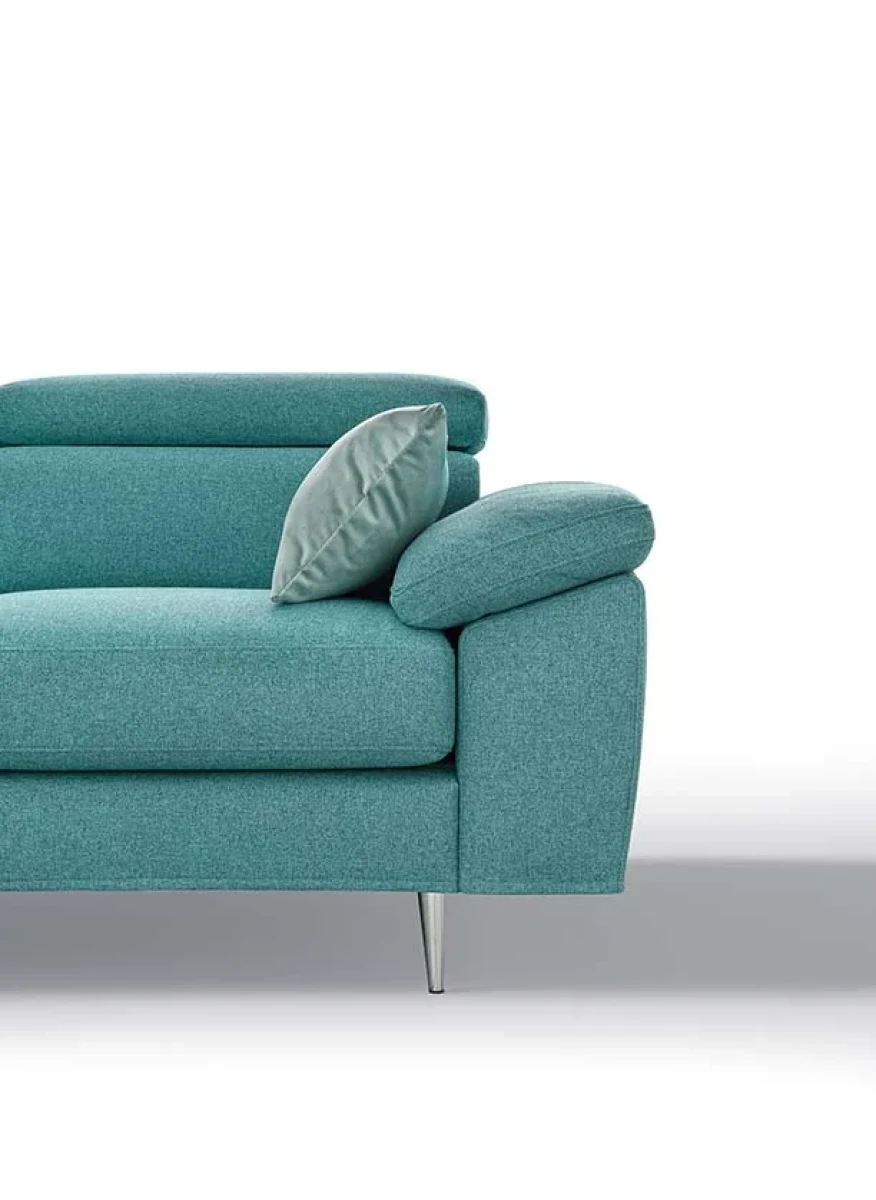 Greta — Modern, minimal sofa with extendable footrest and adjustable headrests.