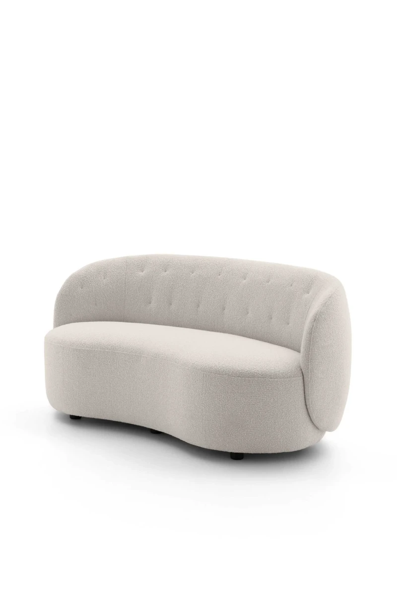 Moby Loveseat — Armless two-seater sofa with a sinuous shape and quilted backrest.