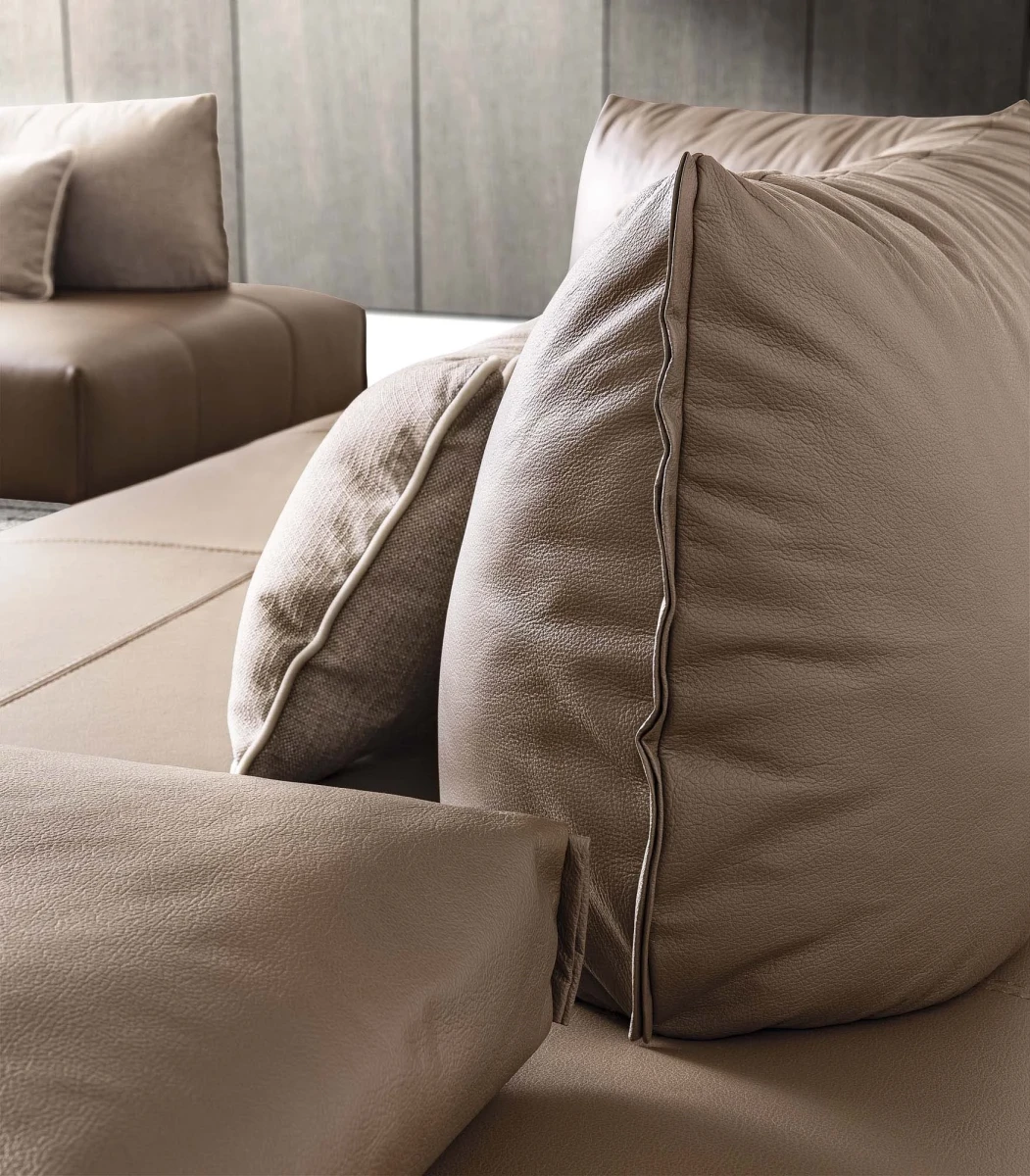 Bacio — Modular sofa with movable backrests – also available in leather.