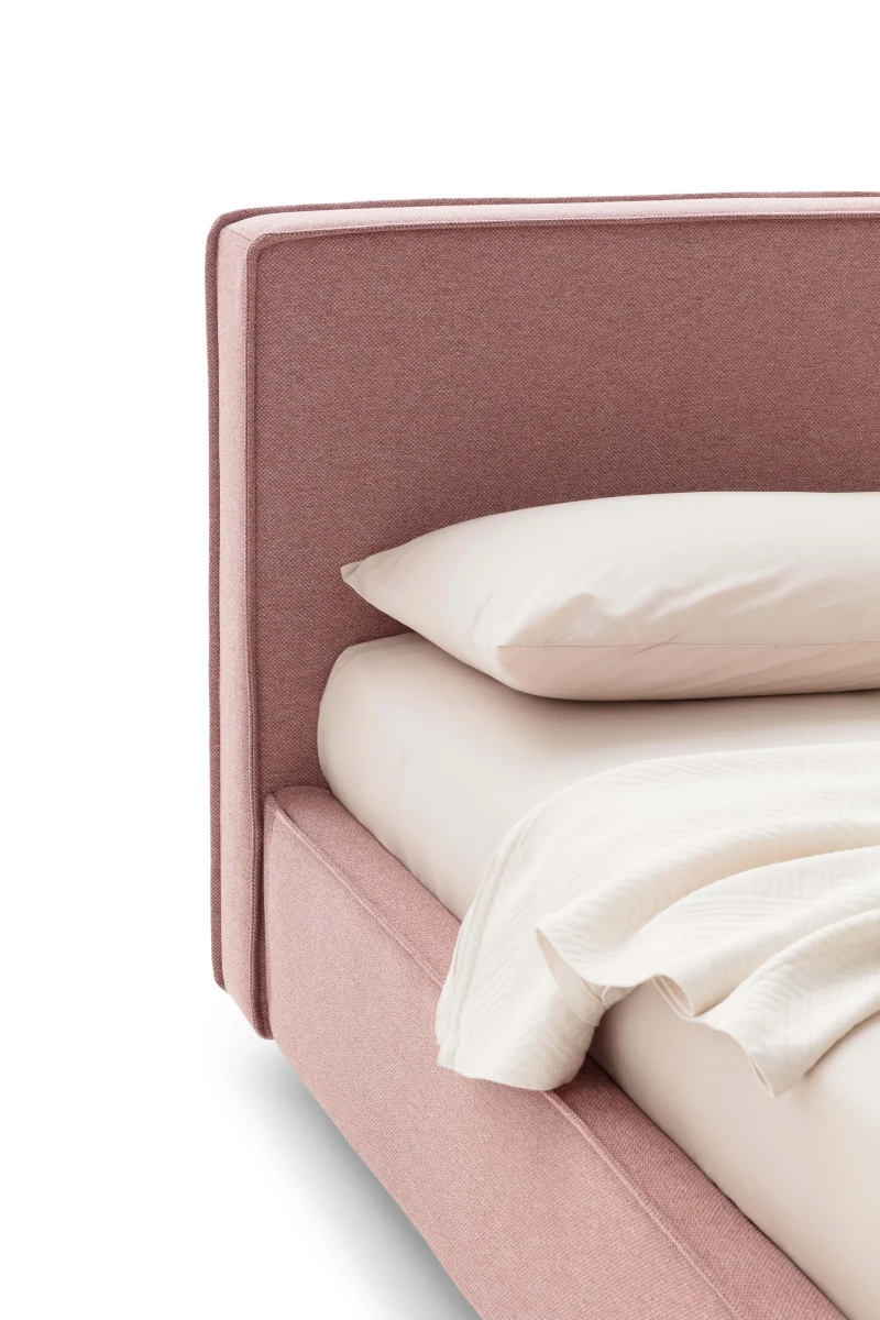 Ipanema — Modern simple bed with a wide headboard and a piping running along the structure.