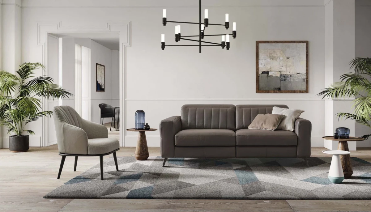 Egon — Recliner sofa with adjustable headrests, and vertically stitched backrest.