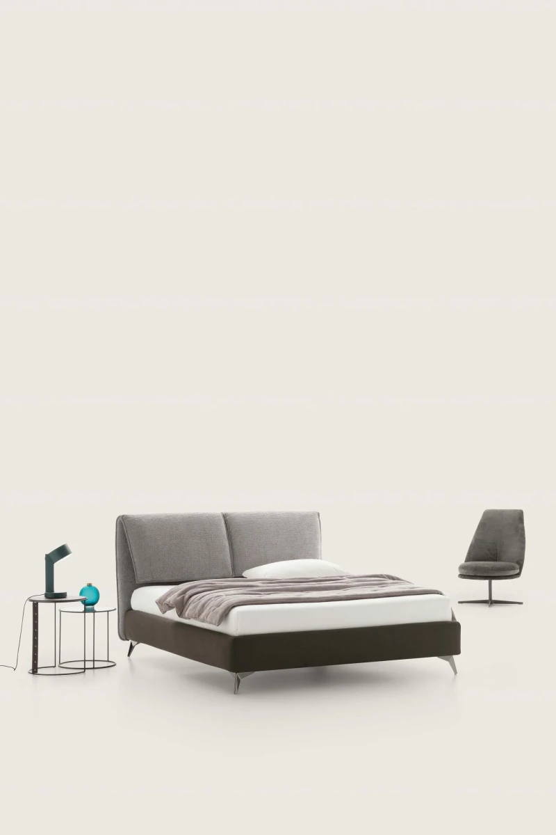 Fold — Bed with a headboard made of large adjustable cushions.