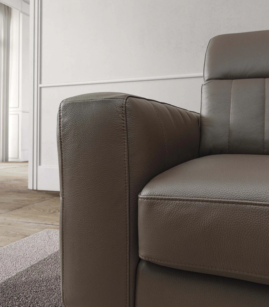 Egon — Recliner sofa with adjustable headrests, and vertically stitched backrest.