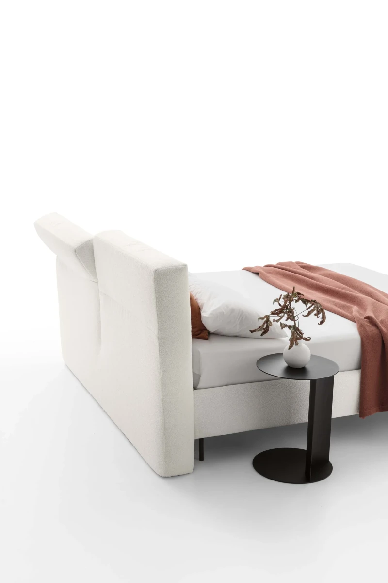 Duo — Bed with an upholstered headboard equipped with an adjustable mechanism.