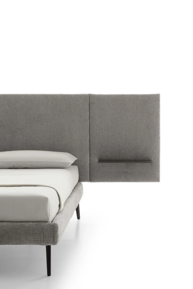 Wall — Contract bed with a simple, smooth padded headboard and side shelves.