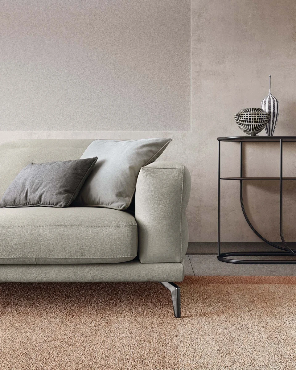Lambert — Modern sofa with sliding seats, adjustable headrests, and raised borders.