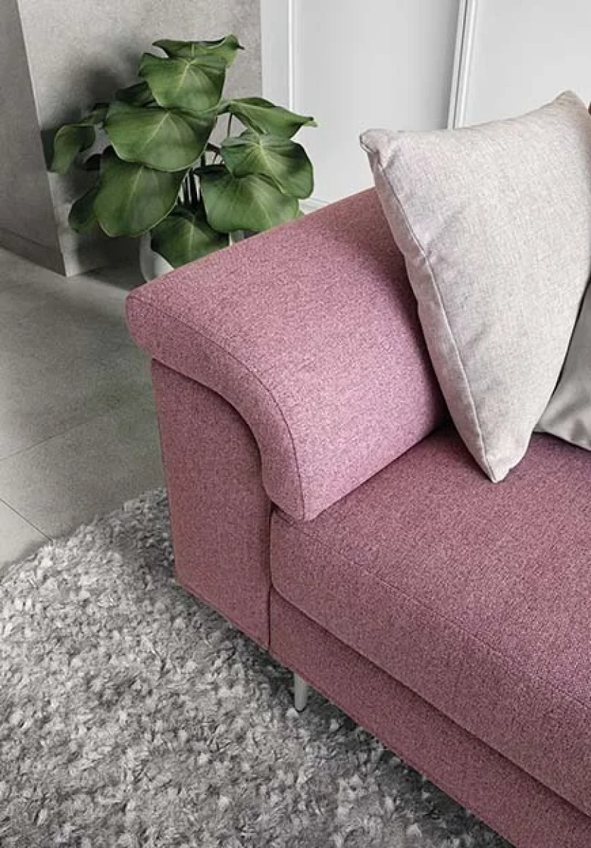 Papilio — Sofa with extendable footrest, rounded armrests, and asymmetrical corner seating.
