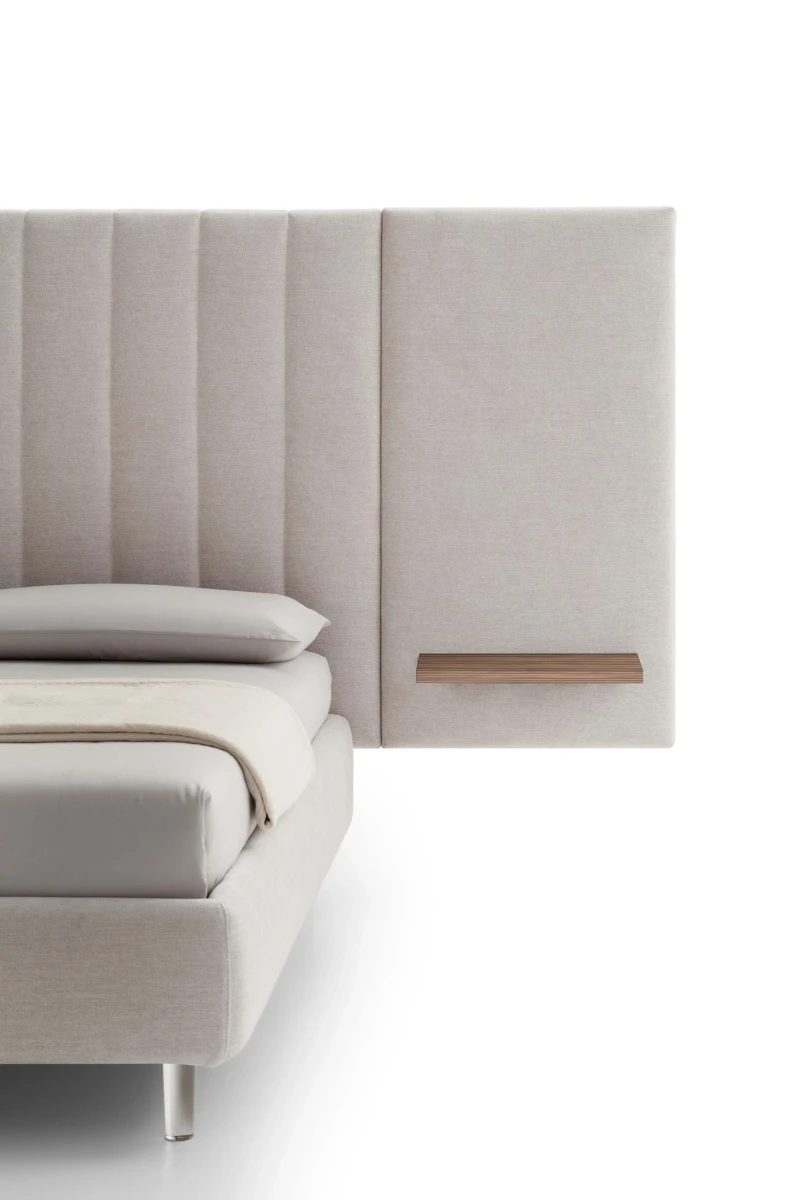 Tile — Contract bed with a vertical padded headboard and side panels with built-in shelves.