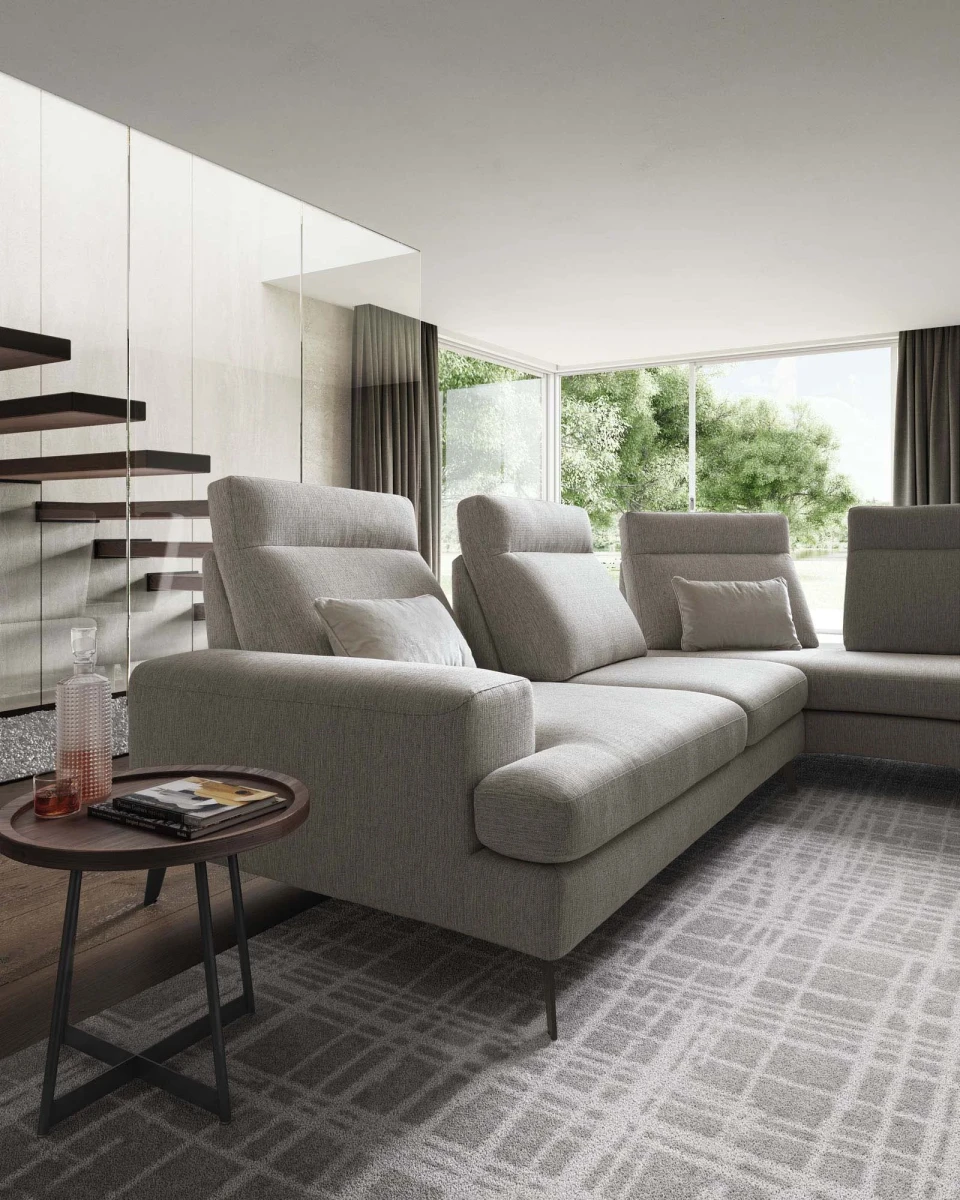 Emmet — Sofa with sliding backrests.
