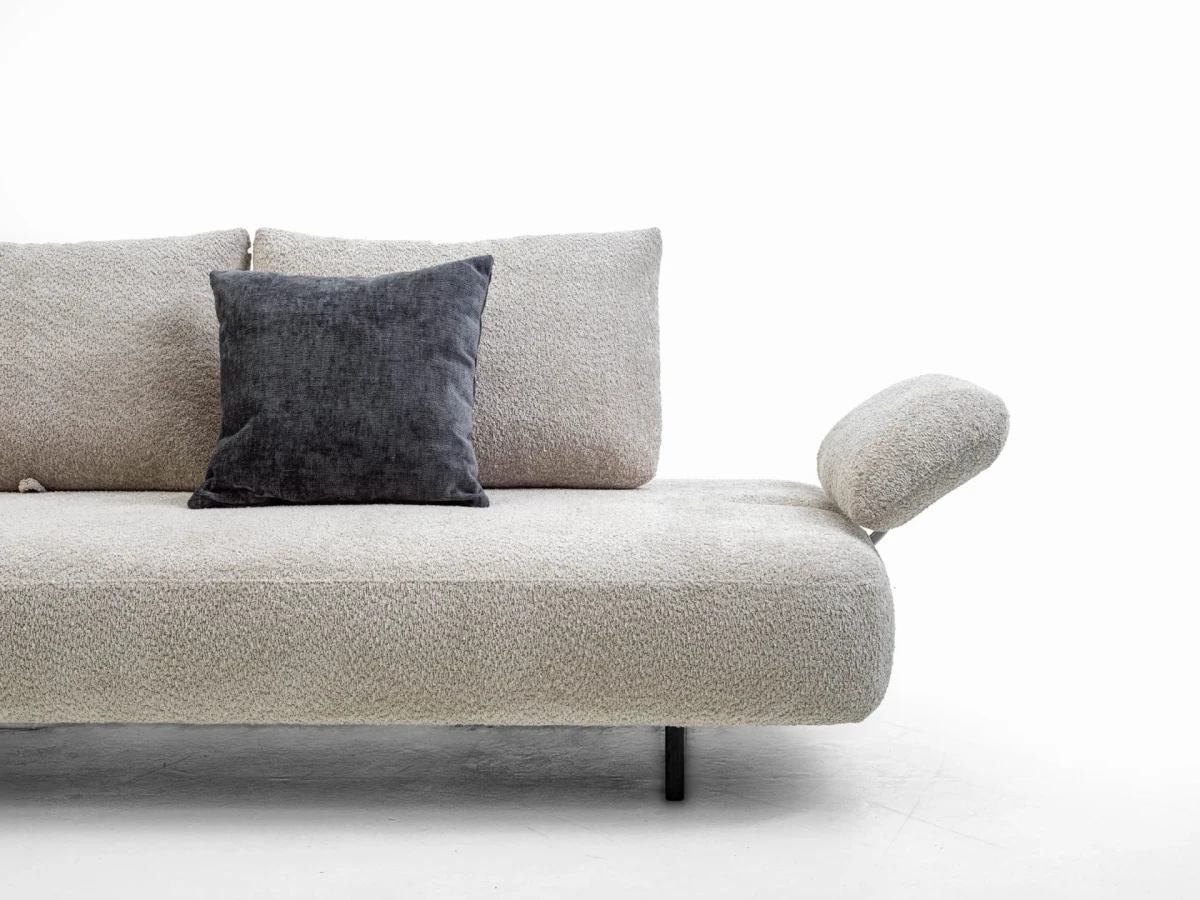 Fanny — Modular sofa with organic shapes, sliding backrests, and adjustable armrests