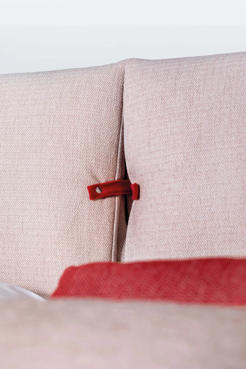 Primrose — Space-saving bed with a headboard featuring large padded cushions secured with buckles.