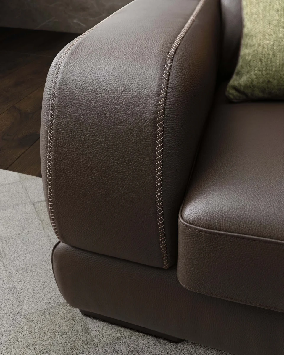 Graffiti — Elegant sofa with extendable seats, adjustable headrests, and visible stitching.