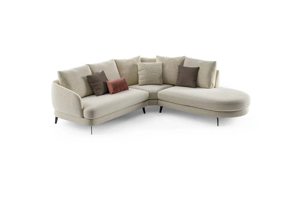 Jand — Sofa with organic shapes, high legs, round end modules, and shaped seats
