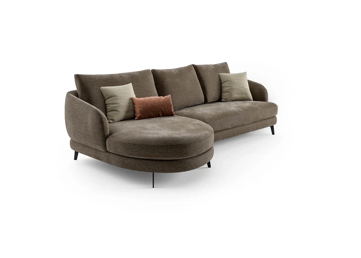 Jand — Sofa with organic shapes, high legs, round end modules, and shaped seats