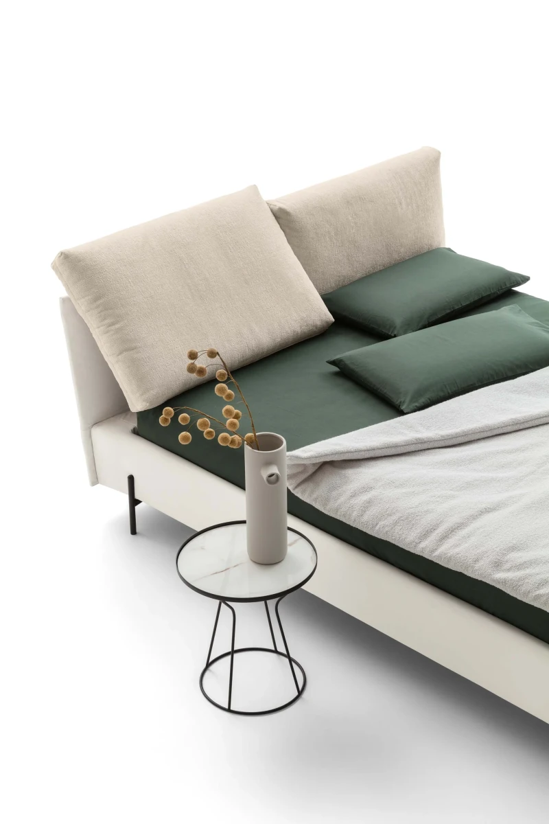 Ischia — Bed with a headboard made of a large, comfortable, and movable cushion.