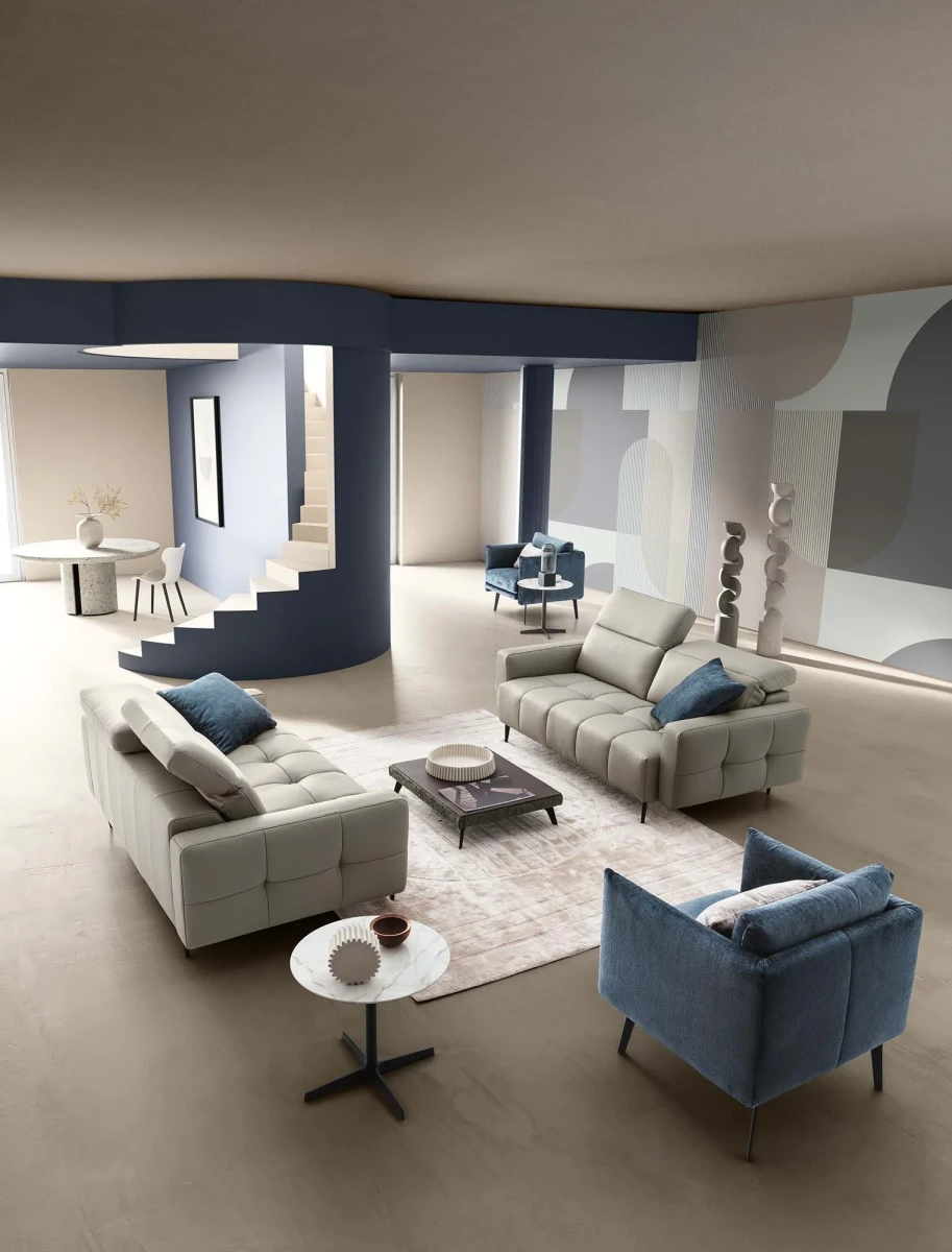 Gillan — Modular sofa with a rounded design, adjustable headrests, and a chaise lounge.