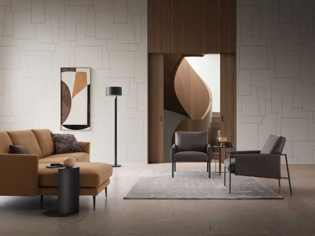 Andy — Armchair with painted metal frame and padded seat, backrest, and armrests. Contemporary industrial design.