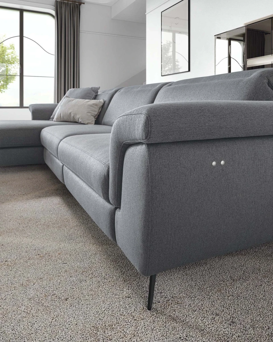 Zeno — Modern recliner sofa with adjustable headrests in a curved, enveloping design.