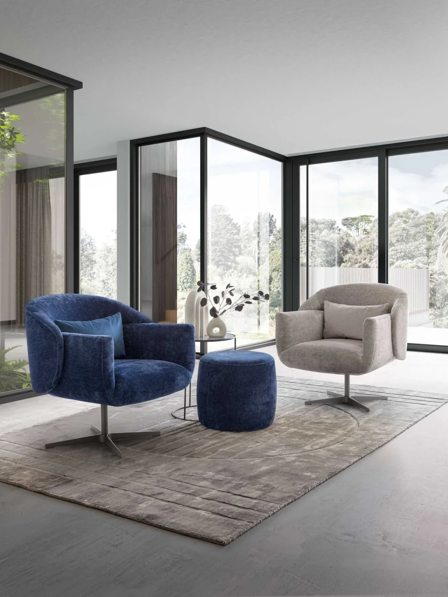 Wrap — Futuristic armchair available with a fixed or swivel base, featuring sleek and modern lines.