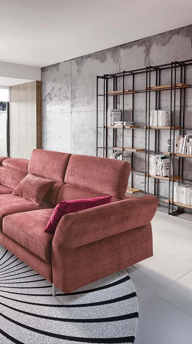 Aurora — Sofa with asymmetrical corner seating, adjustable headrests and armrests, and extendable footrest mechanism.