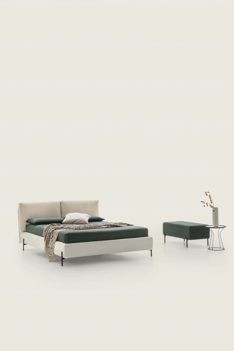 Ischia — Bed with a headboard made of a large, comfortable, and movable cushion.