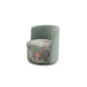 Isabel — Round-based barrel-like design armchair with a sleek backrest and perimeter stitching.