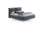 Catlin — Bed with a headboard composed of padded cushions with wide borders.